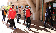 Pitso Mosimane and his Al Ahly coching staff arrive at Lucas Moripe Stadium in Atteridgevile on May 22 2021.  