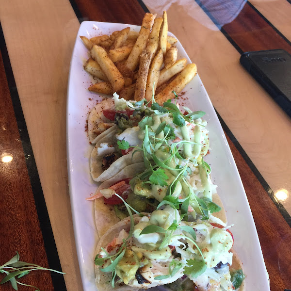 Mahi-mahi tacos with avocado aioli and slaw.