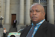 Investigating officer Lt-Col Julian Tarentaal from the Provincial Organised Taxi Violence Unit, in front of the Western Cape High Court. 