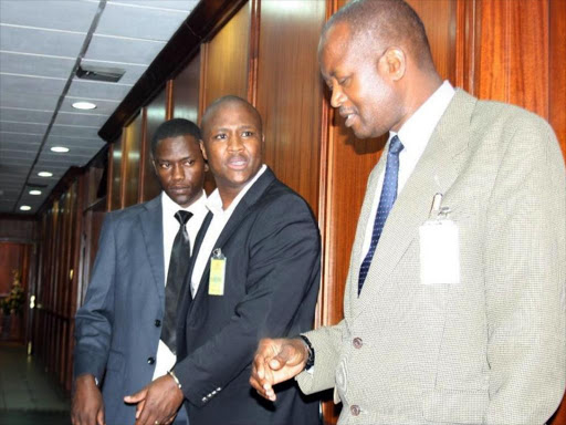 Nandi Hills MP Alfred Keter (C) with detectives at the CBK offices after his arrest on Friday./JOSEPH NDUNDA