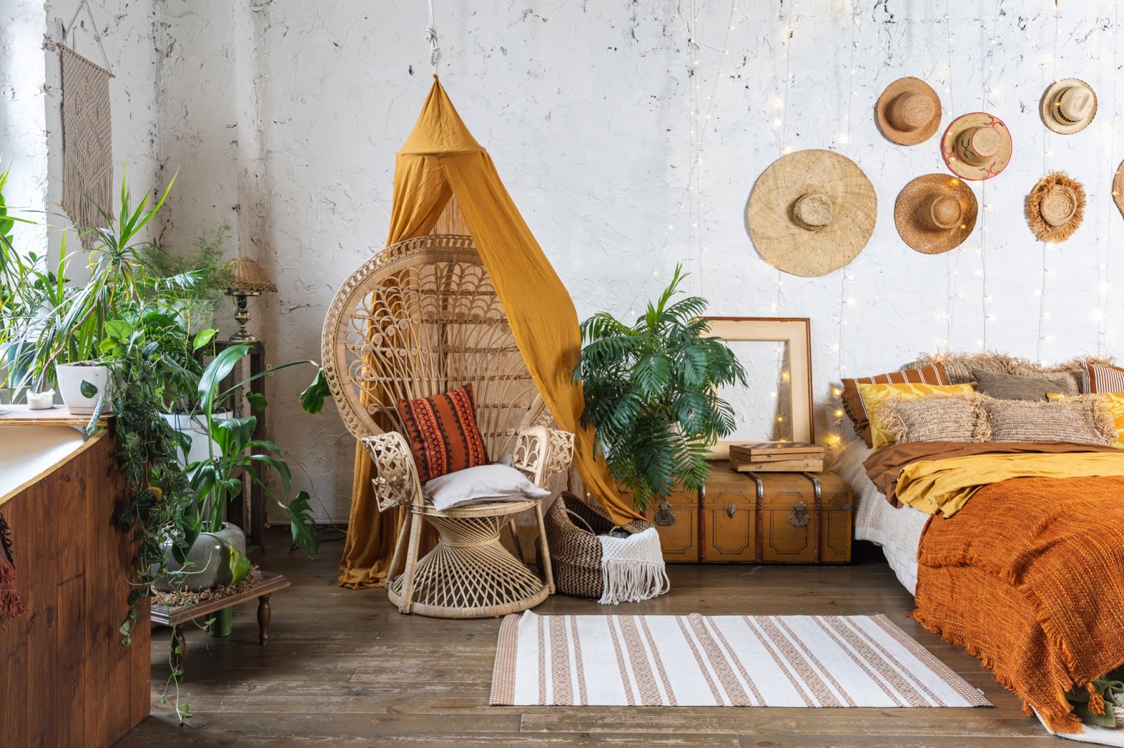 Bohemian living room featuring neutral and jewel tones, layered textures and fabrics and biophlic elements.