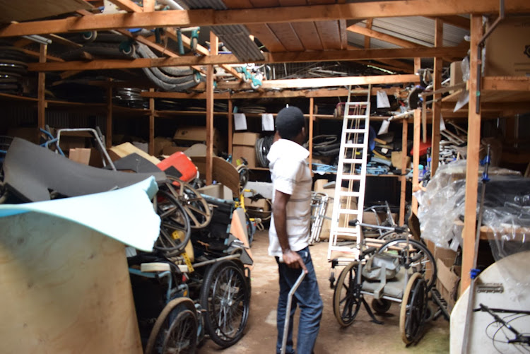 Dennis Murimi in a wheelchair workshop Joytown Primary School for the Physically Handicapped in Thika.