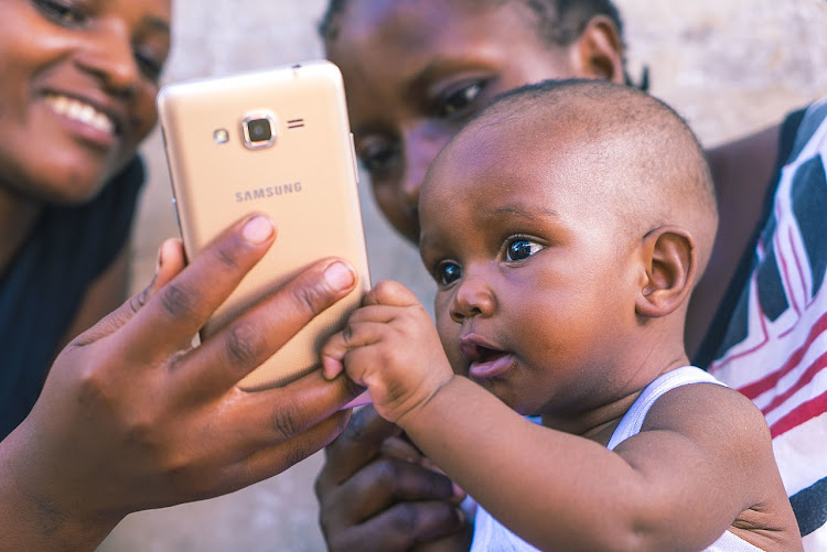 Child uses smartphone