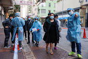 Residents queue up for the mandatory coronavirus disease (Covid-19) testing at a makeshift community testing centre at Jordan, in Hong Kong, China January 19, 2021. 