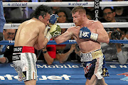 HEAD SHOT  Saul Canelo Alvarez catches  Julio Cesar Chavez jnr with an uppercut during their catchweight bout at T-Mobile Arena  in Las Vegas, Nevada, in  May.