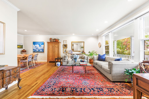 Living room with Persian rug and outdoor view - Luxury house for sale in Rye, 3 bedrooms