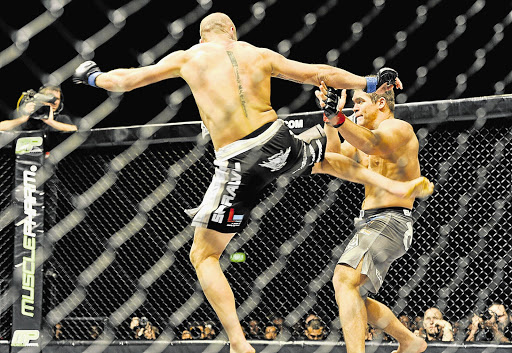 HUNGRY: Vegetarian Norm Wessels, pictured kicking out at Dain Neveling, wants the light-heavyweight belt from Gideon Drotschie