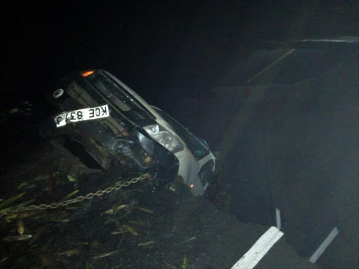 A vehicle is towed after crashing into a gulley dug by floodwaters at Mai Mahiu on Nairobi-Narok road on Wednesday, March 14, 2018. /COURTESY