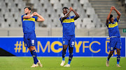 Cape Town City's Austrian midfielder Roland Putsche (L) celebrates a goal with teammates during an Absa Premiership match. 