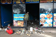 Clean-up efforts were under way on Thursday in Alexandra, Johannesburg, after days of looting saw stores being gutted. 