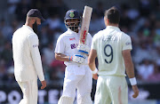 India's Virat Kohli, centre, has words with England's Moeen Ali and James Anderson during the third Test at Headingley in Leeds.