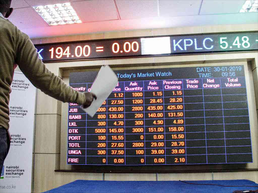 An investor points screen display of daily tradings at the Nairobi Stocks exchange in Nairobi on January 30,2019. Photo/Enos Teche.