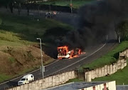 Protesters set a city bus alight in Durban's Overport area on Monday, February 4, 2019