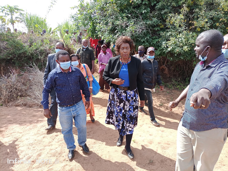 The Ithui horticultural farmers’ cooperative society chairman Peter Manzi (pointing) welcomes governor Charity Ngilu as she arrived to inspect and horticultural farm belongs to Jack Mulinge on Monday.