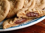 Hershey Drop Stuffed Peanut Butter Cookies was pinched from <a href="http://amandascookin.com/2013/11/hershey-drop-stuffed-peanut-butter-cookies.html" target="_blank">amandascookin.com.</a>