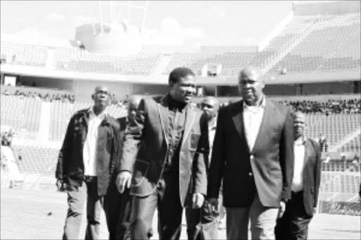 SEAL OF APPROVAL: Deputy Minister of Police Fikile Mbalula, left, chats to Limpopo Premier Cassel Mathale during the official opening of the Peter Mokaba Complex on Saturday. Mathale urged Limpopo people to use the stadium with care and dignity since it was their property and not only for the 2010 World Cup. Pic: ELIJAR MUSHIANA. Circa January 2010. © Sowetan.26 JANUARY 2010 TUESDAY:SKILLS: A Deputy Minister of police Fikile Mbalula speaks to a Limpopo premier Cassel Mathale during the official opening of the Peter Mokaba complex on Saturday. Mathale urges Limpopo people to use the stadium with care and dignity because it is their property, not only for 2010 World Cup. PHOTO: ELIJAR MUSHIANA