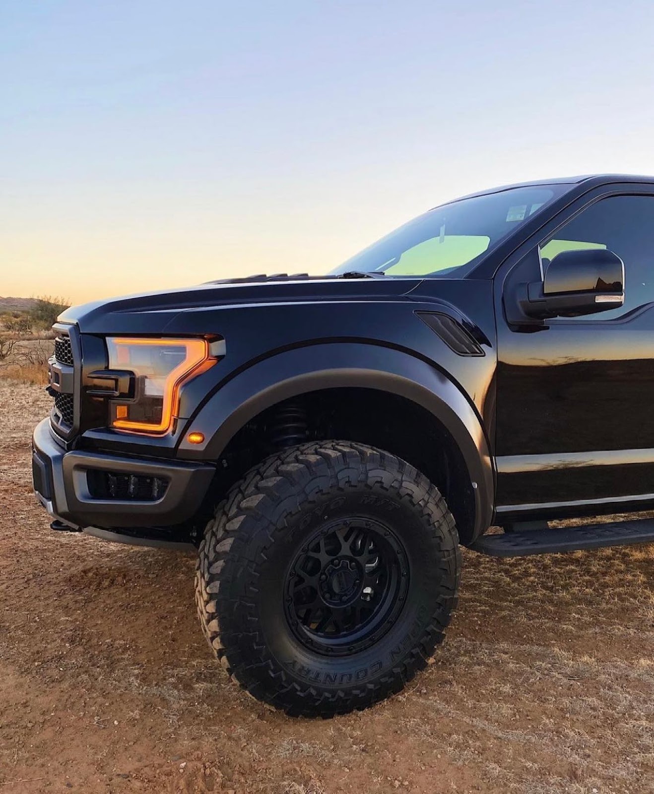 Geiser springs installed on a black Ford Raptor