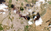 A satellite image shows smoke rising from Mekelle, Ethiopia, October 20, 2021.