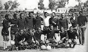 Kaizer Motaung, fourth left, and his Kaizer Chiefs teammates pose for a team photo before a match at Orlando Stadium in the 1970s.