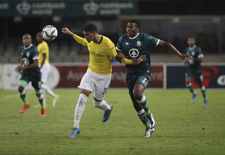 Rushine De Reuck of Mamelodi Sundowns wins a header against Bonginkosi Ntuli of AmaZulu in the DStv Premiership match at Kings Park in Durban on December 20 2021.