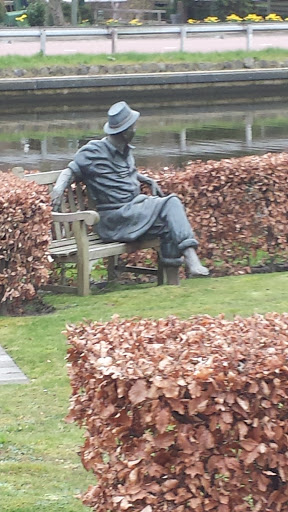 Man Sitting On Bench