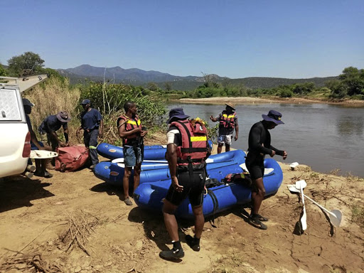 Police divers at the Crocodile River where Enoch Mpianzi drowned