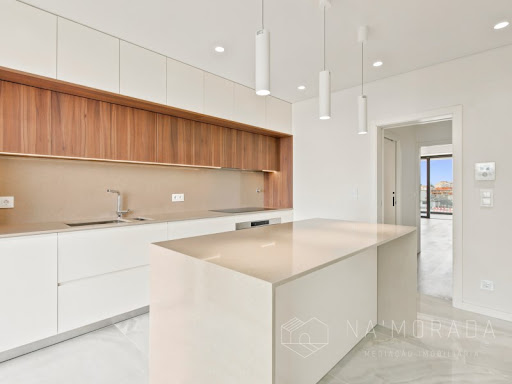Modern kitchen with white central island - Buy this luxury apartment / penthouse in Mafamude, 4 bedrooms