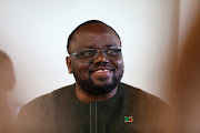 Zambia's mines minister Paul Kabuswe poses for a photograph at the Investing in African Mining Indaba in Cape Town.