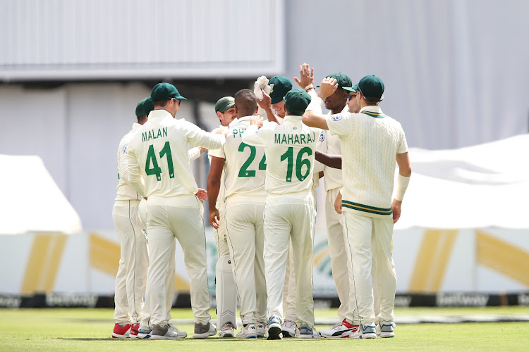 Quinton de Kock of South Africa and Vernon Philander of South Africa are congratulated for getting Zak Crawley of England wicket during day 1 of the International Test Series 2019/20 game between South Africa and England at Newlands Cricket Ground, Cape Town on 3 January 2020.