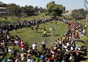 An overview of regiments having a stick fight at KwaDukuza.