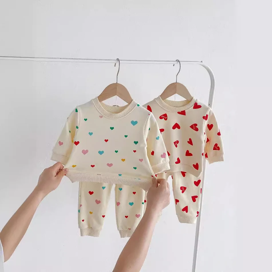 Kleurrijke, liefdevolle Western-stijl sweater tweedelige set. Voor een warme, modieuze look met een unieke stijl.