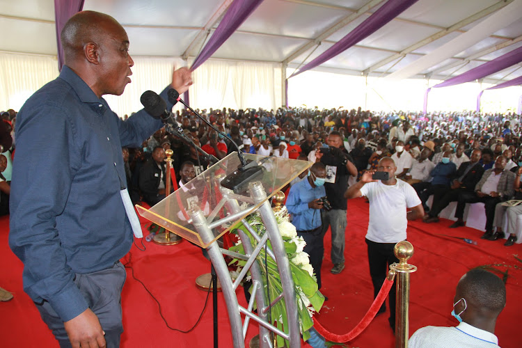 Former PM Raila Odinga's aide Caroli Omondi speaks to mourners at the burail of his mother in Nyatambe, Suba South constituency on February 4,2022