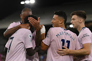 Bukayo Saka of Arsenal celebrates their side's second goal with teammates , after Marc Guehi of Crystal Palace ( not pictured ) concedes an own goal, during the Premier League match between Crystal Palace and Arsenal FC at Selhurst Park on August 05, 2022 in London, England. 