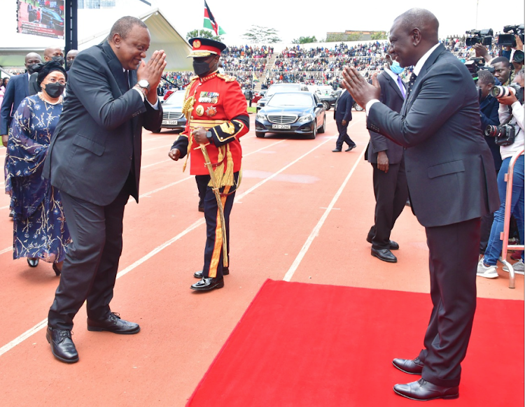 Deputy President William Ruto receives President Uhuru Kenyatta and First Lady Margaret Kenyatta at Nyayo National Stadium during the state funeral service of former President Mwai Kibaki