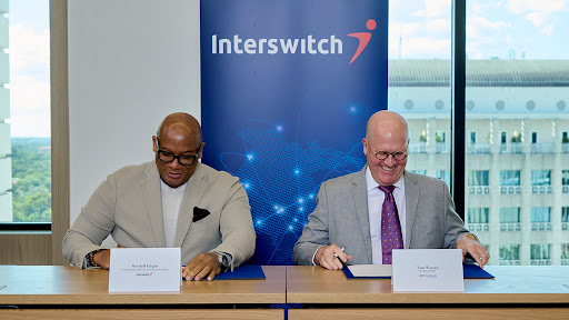 Tom Warsop, CEO, ACI Worldwide (R); Mitchell Elegbe, CEO, Interswitch (L) (Photo: Business Wire)