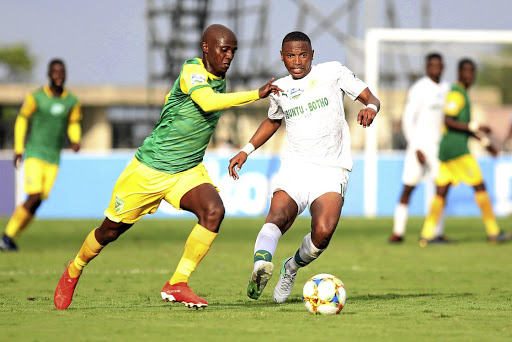 Nduduzo Sibiya of Golden Arrows races past Andile Jali of Mamelodi Sundowns during their Telkom Knockout semifinal at Sugar Ray Xulu Stadium in Clermont, Duban, on Saturday.