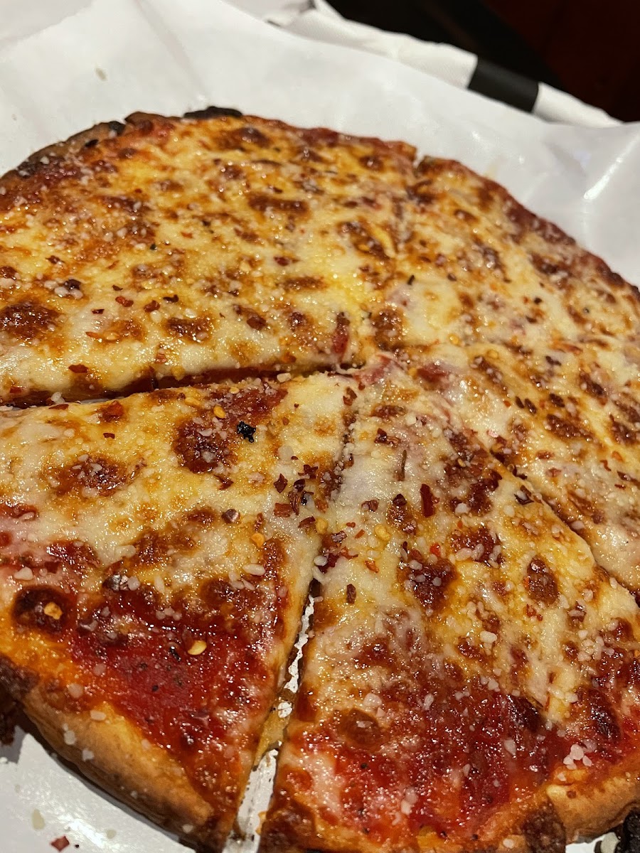 Typical rice crust pizza (pepperoni is burried)