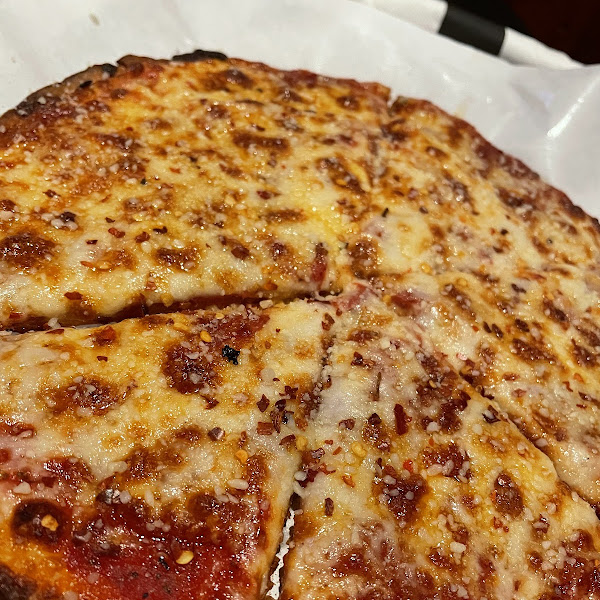 Typical rice crust pizza (pepperoni is burried)