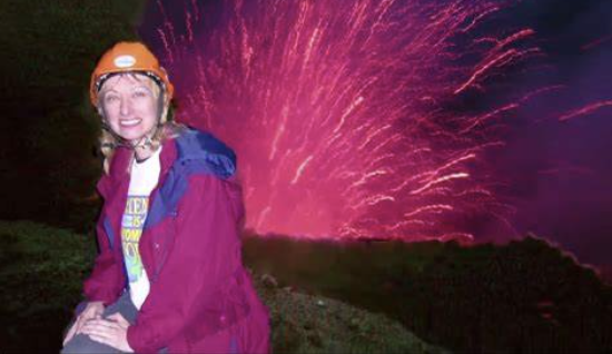 A person wearing a helmet and standing in front of fireworks Description automatically generated with low confidence