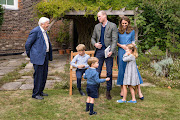 The Duke and Duchess of Cambridge, Prince George (seated), Princess Charlotte and Prince Louis with Sir David Attenborough.