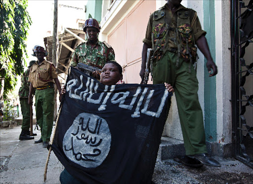 A youth with a jihad banner after being arrested at Majengo area in Mombasa City.