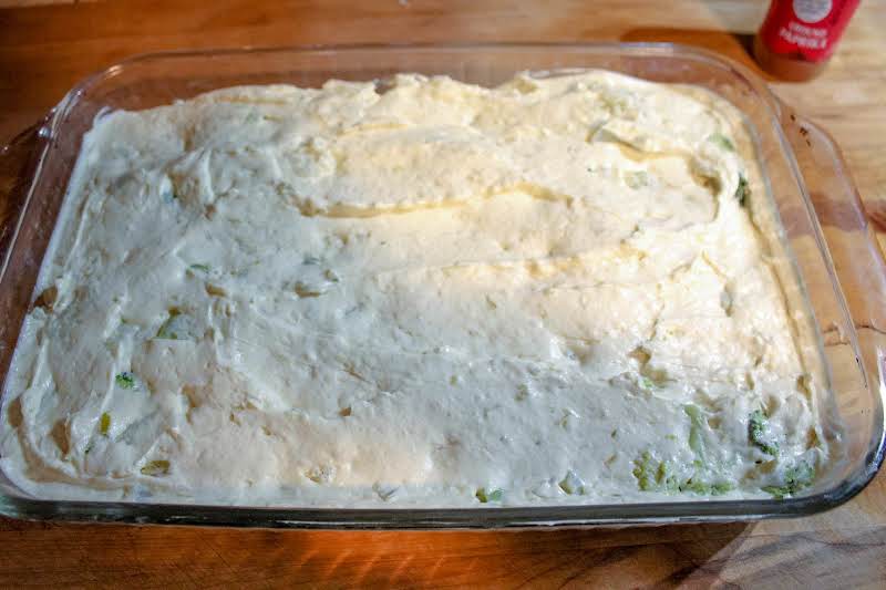 Cream Cheese Mixture Spread Over Broccoli And Cauliflower.