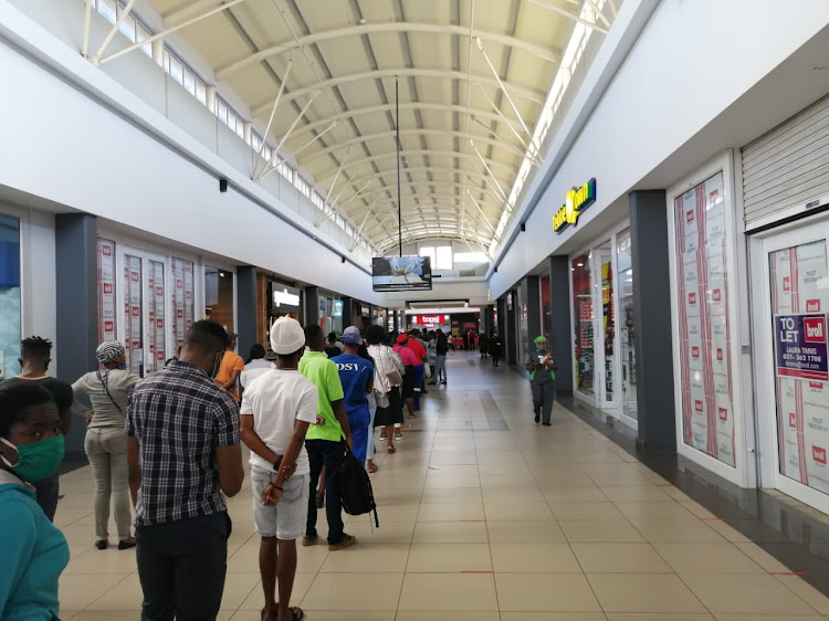 South Africans queue up to get into Tops liquor store on June 1 2020.