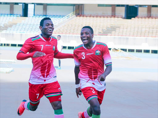 Kenya Ovela Ochieng and James Mazembe celebrate after scoring against Mauritius in the first leg at Moi Stadium, Kasarani. /COURTESY