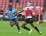  Bulls winger Sbu Nkosi runs with the ball during the United Rugby Championship match against Lions at Emirates Airline Park on September 17, 2022 in Johannesburg, South Africa. 