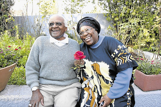 GOLDEN: The day before their 50th wedding anniversary, Archbishop Emeritus Desmond Tutu with his wife Leah, relax in the garden at their home in Soweto