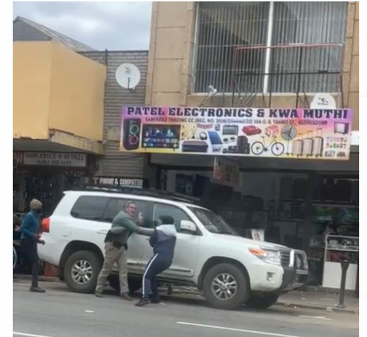 The man is seen fighting back against four men who are trying to rob him or hijack his car in Klerksdorp on Wednesday morning.