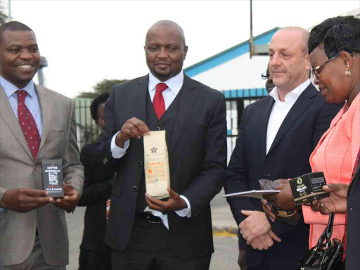 MPs Gabriel Kago (Githunguri), Moses Kuria (Gatundu) and Kiambu Woman Representative Gathoni Wa Muchumba at African Coffee Roasters EPZ Limited in Athi River, Machakos county, July 26, 2018. /GEORGE OWITI