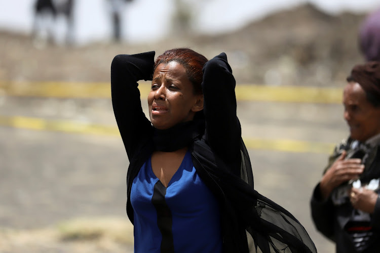 A relative mourns at the scene of the Ethiopian Airlines Flight ET 302 plane crash, near the town Bishoftu, near Addis Ababa, Ethiopia March 14, 2019.