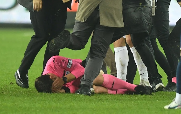 Referee Halil Umut Meler lies on the ground at the end of their Super Lig home match against Caykur Rizespor on December 11. Picture: REUTERS/DEPO PHOTOS